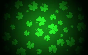 Glowing Green Shamrocks Background Wallpaper