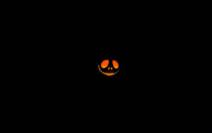 Glowing Jack O Lantern Face Dark Background Wallpaper