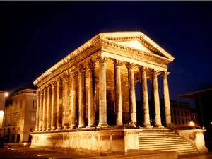 Glowing Maison Carrée At Night Wallpaper