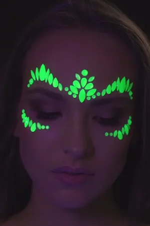 Glowing Neon Makeup Masterpiece Under Black Light Wallpaper