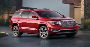 Gmc Acadia Cruising On An Open Road Wallpaper
