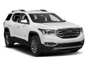 Gmc Acadia Driving Through A Scenic Route Wallpaper