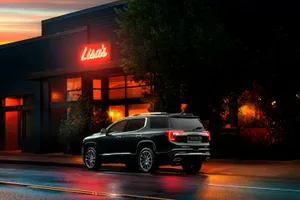 Gmc Acadia On A Scenic Road Trip Wallpaper