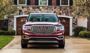 Gmc Acadia On Scenic Road Wallpaper