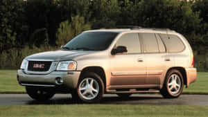 Gmc Envoy Suv On Open Road Wallpaper