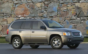 Gmc Envoy Suv On The Road Wallpaper