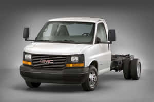 Gmc Savana Cargo Van On The Road Wallpaper