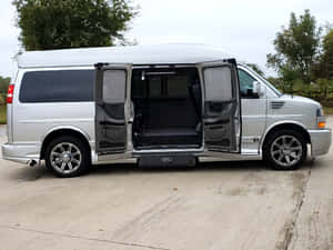 Gmc Savana Van On The Road Wallpaper