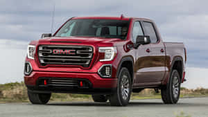 Gmc Sierra Truck On A Mountain Road Wallpaper