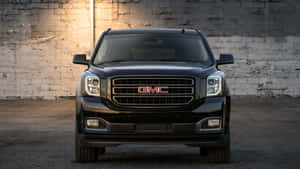 Gmc Yukon Driving On Scenic Route Wallpaper