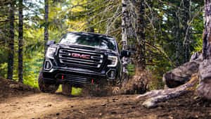 Gmc Yukon In A Stunning Mountain Setting Wallpaper