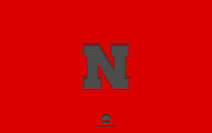 Go Big Red! Nebraska Huskers On The Road To Victory Wallpaper