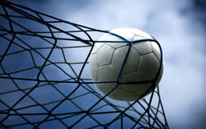 Goal Moment Soccer Ball In Net Wallpaper