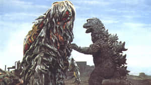 Godzilla Battles Hedorah In An Epic Confrontation Wallpaper