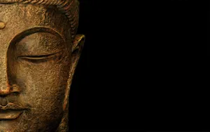 Gold Buddha In Black Wallpaper