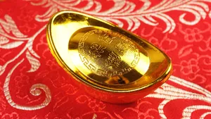 Gold Ingot On Red Fabric Wallpaper