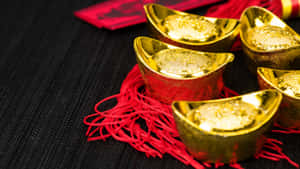 Gold Ingots On Red Cloth Wallpaper