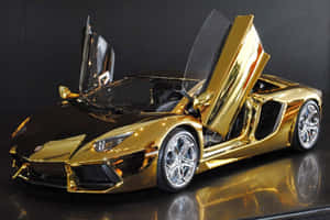 Gold Lamborghini With Glossy Finish Wallpaper