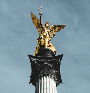 Golden Angel Sculpture Wallpaper