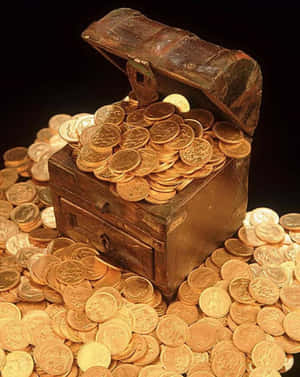 Golden Coins Overflowing From A Vintage Trunk Wallpaper