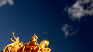 Golden Horse Statue Against Sky Wallpaper