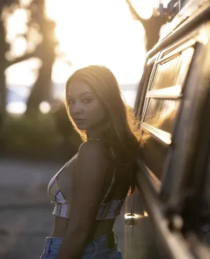 Golden Hour Portrait Beside Vehicle Wallpaper