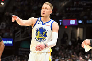 Golden State Warriors Player Gesturing During Game Wallpaper