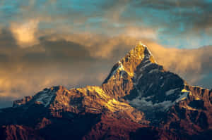 Golden Summit At Dusk_ Mountain Peak Wallpaper