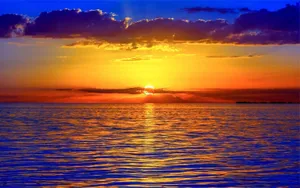 Golden Sunset Purple Sky Ocean Wallpaper