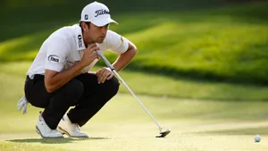 Golfer Evaluating Puttat The Players Championship Wallpaper