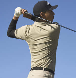 Golfer Finishing Swing Wallpaper