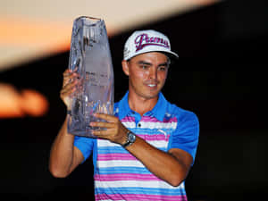 Golfer Holding Trophyat The Players Championship Wallpaper