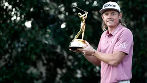 Golfer Holding Trophyat The Players Championship Wallpaper
