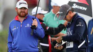 Golfer Jb Holmes With Umbrella Wallpaper