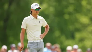 Golfer Min Woo Lee Focused During Tournament Wallpaper