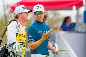 Golferand Caddie Strategy Discussion Wallpaper