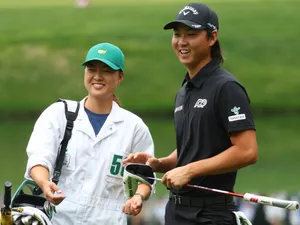 Golfers Smiling During Tournament Wallpaper