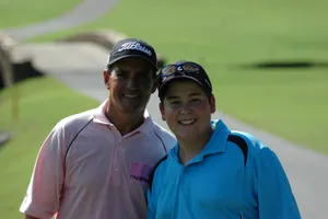 Golfers Smiling On Green Course Wallpaper