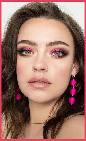 Gorgeous Woman Flaunting A Fresh And Vibrant Spring Makeup Look Wallpaper