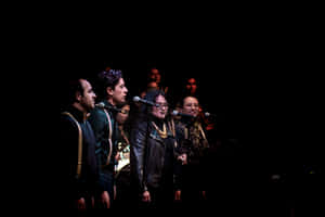 Gospel_ Choir_ Performance_in_ Spotlight Wallpaper