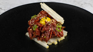 Gourmet Steak Tartare Dish With Spices And Accompaniments Wallpaper