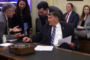 Government Officials Discussion Wallpaper