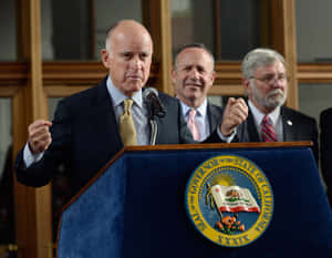 Governor Jerry Brown Excitedly Celebrates A Victory Wallpaper