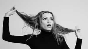 Grace Van Dien Striking A Confident Pose Wallpaper