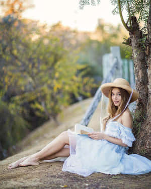 Grace Van Dien Striking A Pose In A Chic Outfit Wallpaper