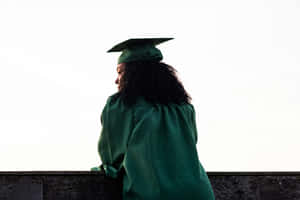 Graduate Contemplating Future Silhouette Wallpaper