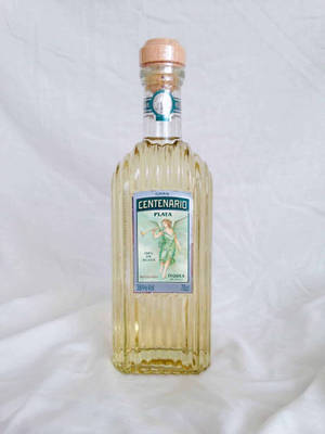 Gran Centenario Tequila Plata On White Cloth Wallpaper