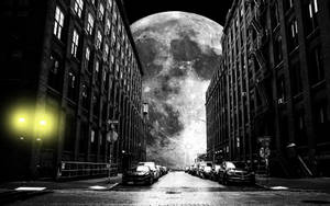 Grayscale Galaxy Moon Behind Buildings Wallpaper