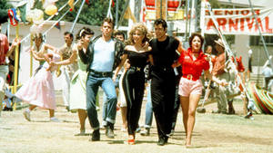 Grease Characters Walking At Carnival Wallpaper