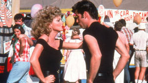 Grease John And Olivia Dancing Wallpaper